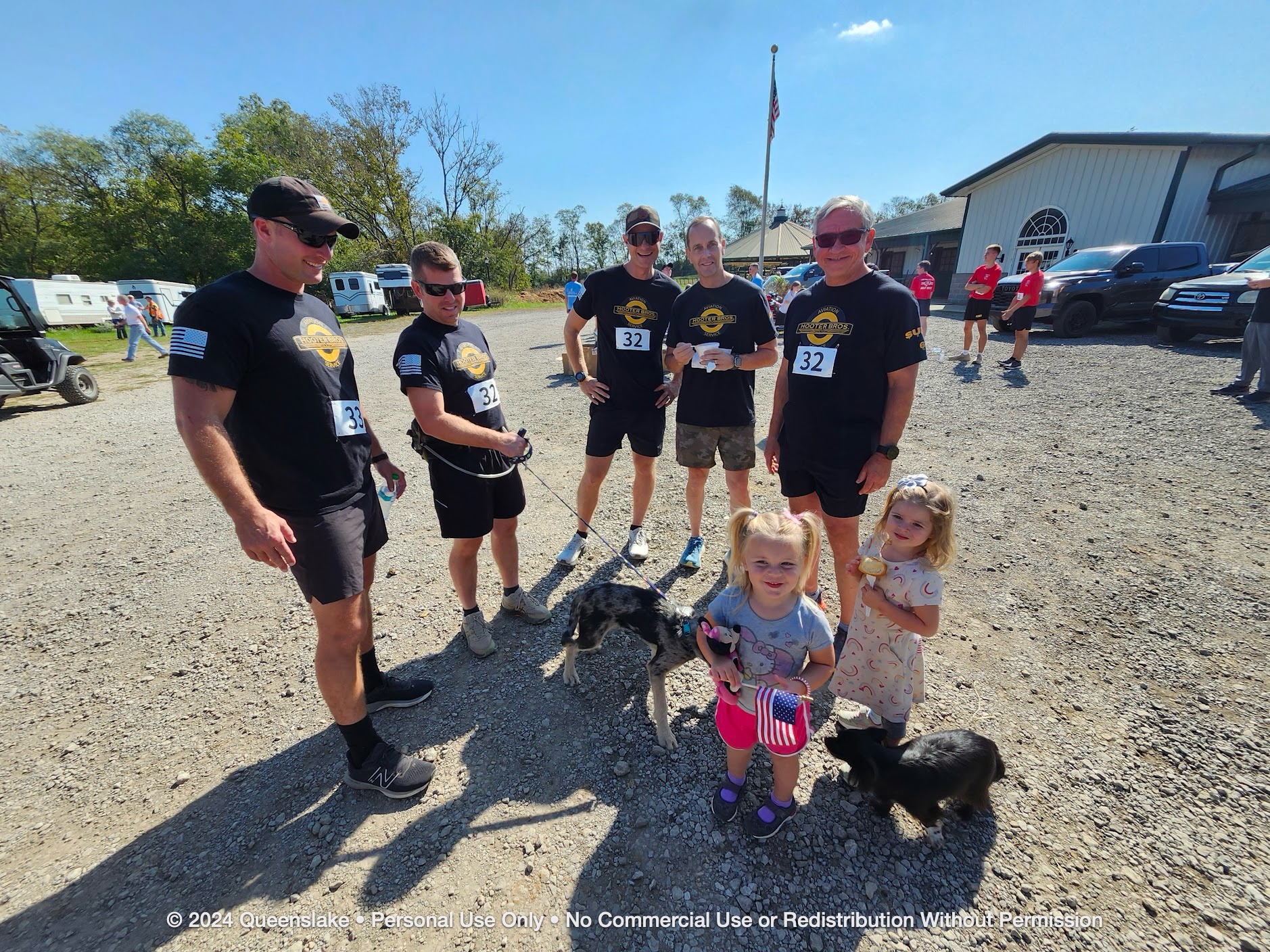 Fellowship and family: Mike Durant, Dan Jollota, and Jim Yacone with host John Chmela's daughter Aspen at Queenslake.
